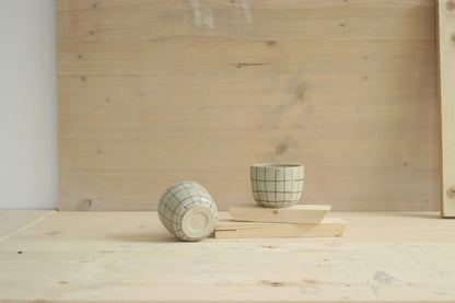 Handmade speckled stoneware ceramic sip cup in grid pattern and clear glaze. Made with lots of love in Lithuania.