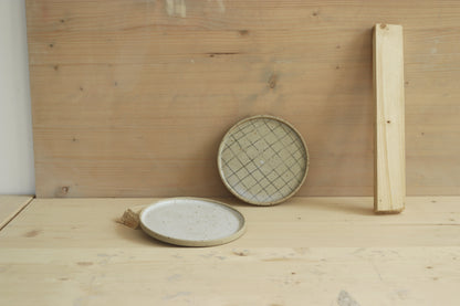 Handmade speckled stoneware ceramic snack plates: in grid pattern and covered in clear glaze and in white satin glaze. Made with lots of love in Lithuania.